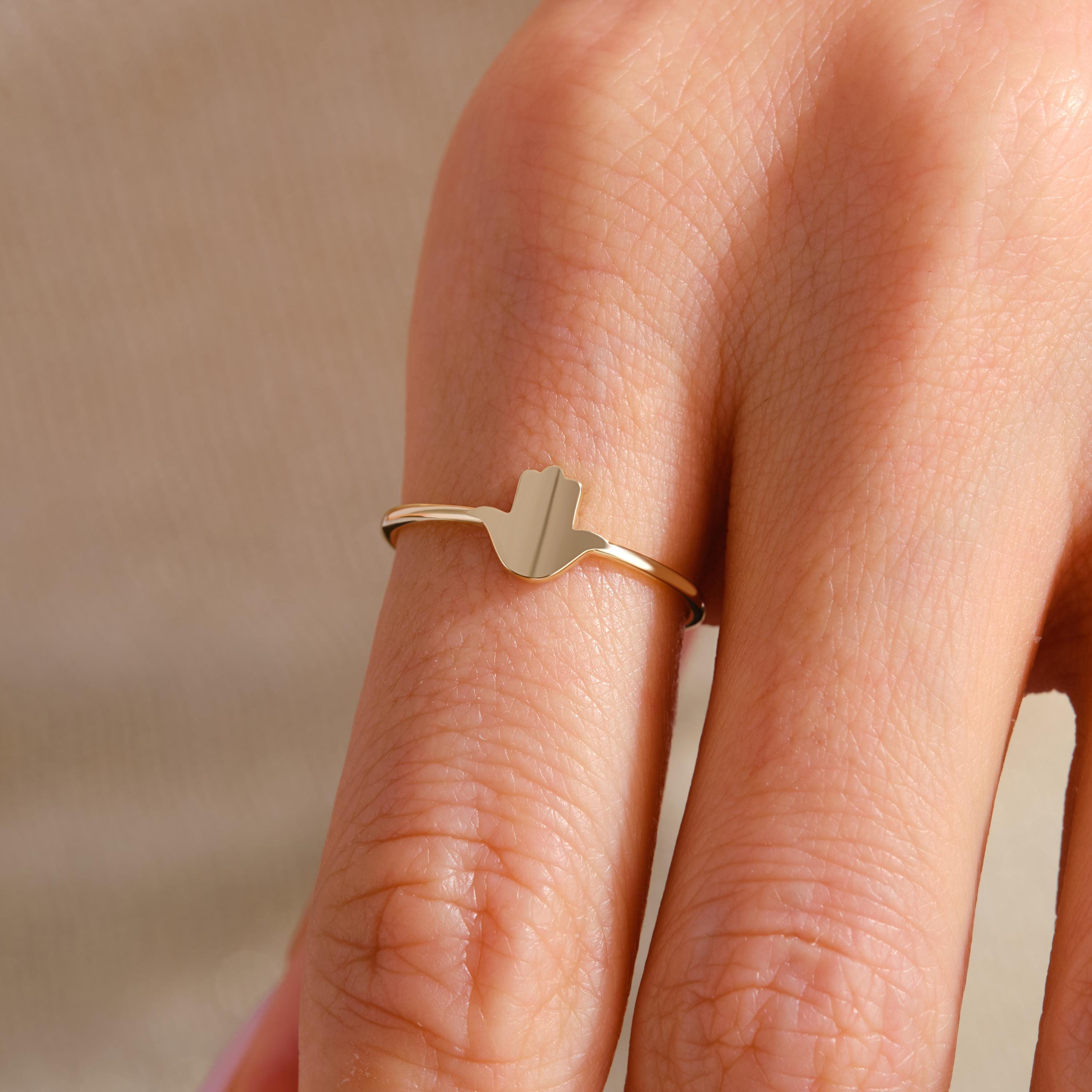 Hamsa Hand Ring – 10K / 14K / 18K Solid Gold 🧿✨
A meaningful Hamsa Hand design symbolizing luck, protection, and positive energy. This dainty gold band can be worn alone or stacked with other rings, making it a perfect everyday piece and a thoughtful gift.