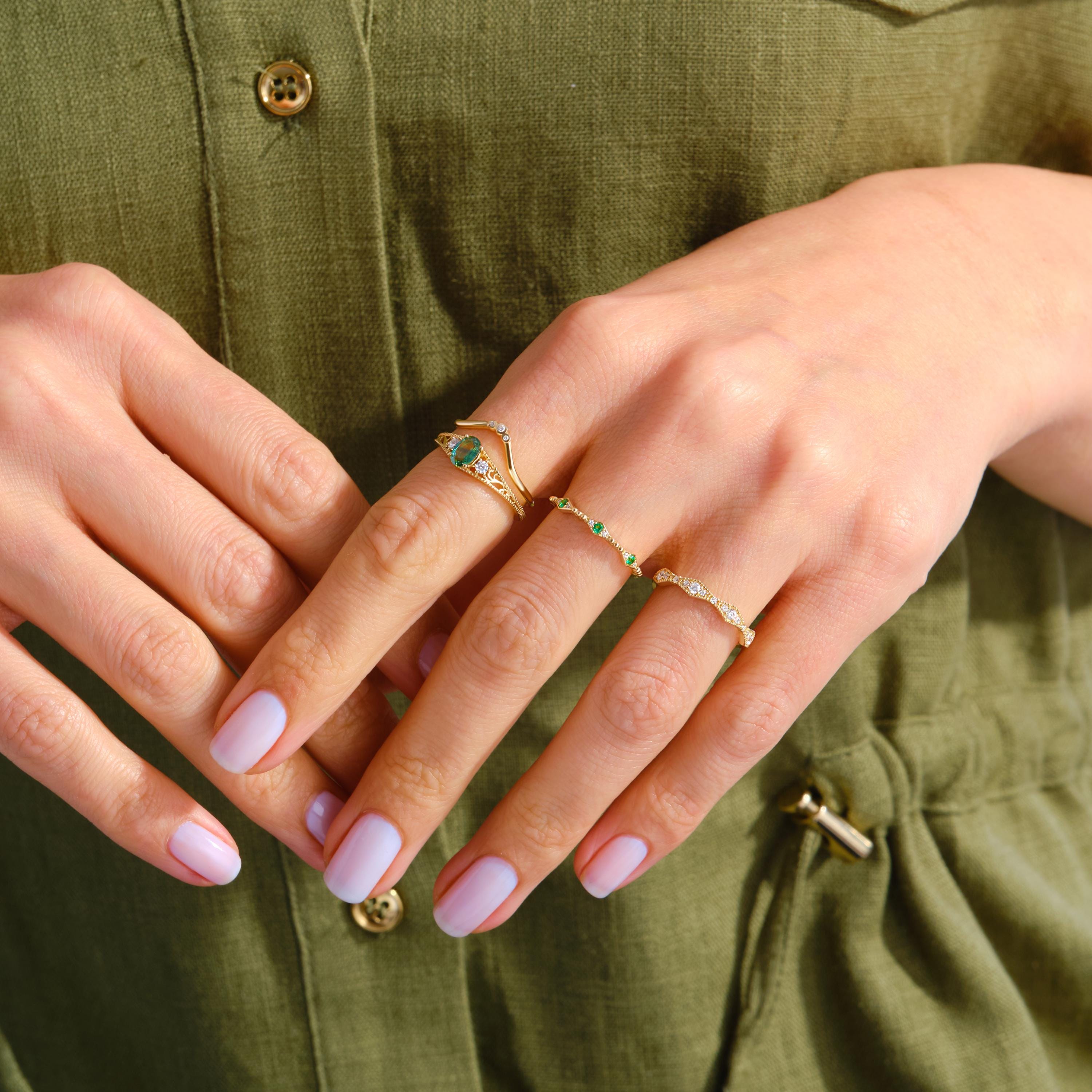 Dainty Emerald Stacking Ring – 10K / 14K / 18K Solid Gold 💚✨
A delicate emerald ring accented with sparkling side diamonds, perfect for stacking or wearing alone. Its elegant and minimalist design makes it a thoughtful birthstone gift or a charming everyday accessory.