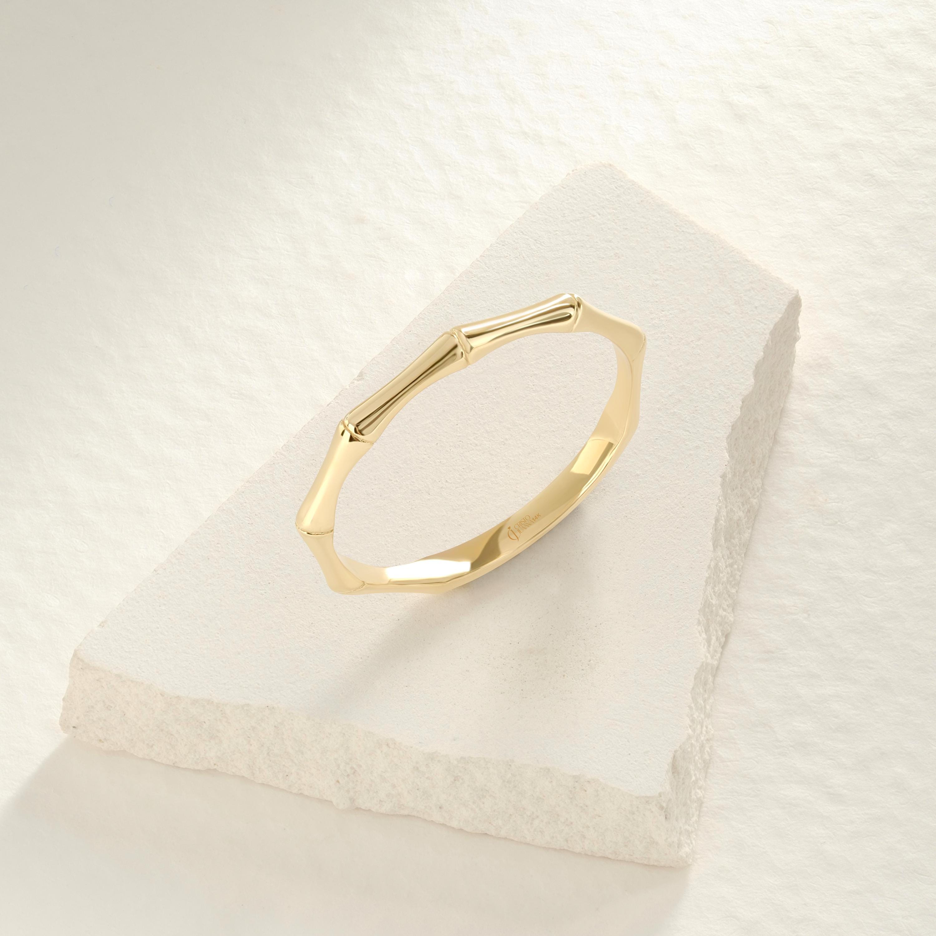 Elegant and nature-inspired bamboo ring gold 14K design, perfect for stacking or gifting. This gold stackable ring features a delicate texture, making it a stylish dainty boho ring 10K option. A true designer bamboo ring ideal as a summer jewelry gift or thoughtful ring gift for her. Choose a custom engraved ring for a unique touch. Our bamboo band ring 18K is a handcraft ring gold piece made with care. A meaningful personalized present for her as a birthday or her promise ring.