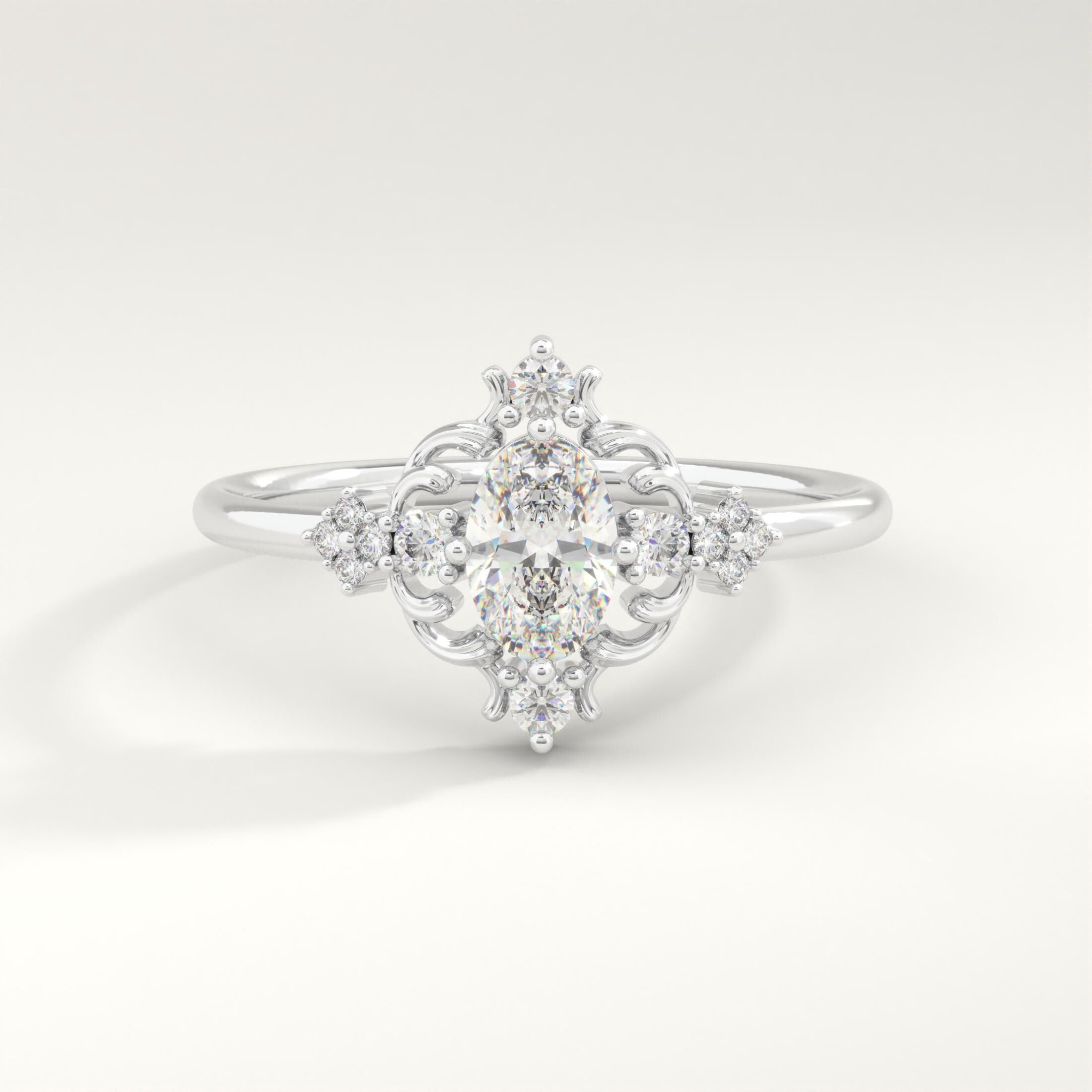 Oval Diamond Engagement Ring – 10K / 14K / 18K Solid Gold ✨💍
A timeless piece that blends vintage charm with modern elegance. Featuring a sparkling 6x4 mm oval-cut diamond (or moissanite) surrounded by delicate side stones, this ring makes a stunning choice for engagements, anniversaries, or milestone moments. 💎