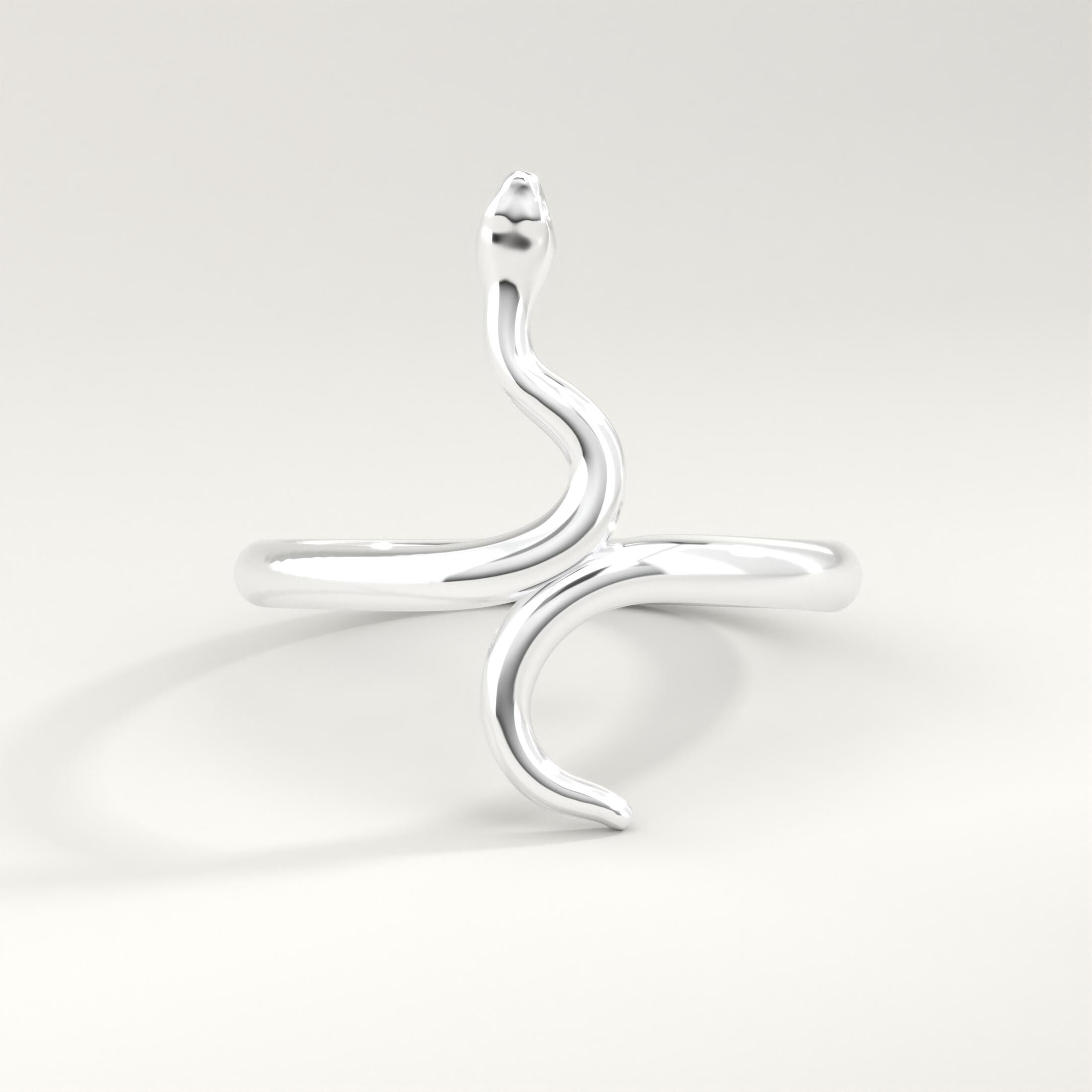 🐍 Snake Ring 14K Solid Gold – Minimalist Serpent Stackable Ring for Women

Add a touch of mystique and elegance to your jewelry collection with this stunning 14K solid gold snake ring. Designed for everyday wear, this minimalist serpent ring beautifully wraps around your finger with a delicate yet bold style. Perfect for stacking or wearing solo, it’s a unique piece that blends gothic charm with modern sophistication.