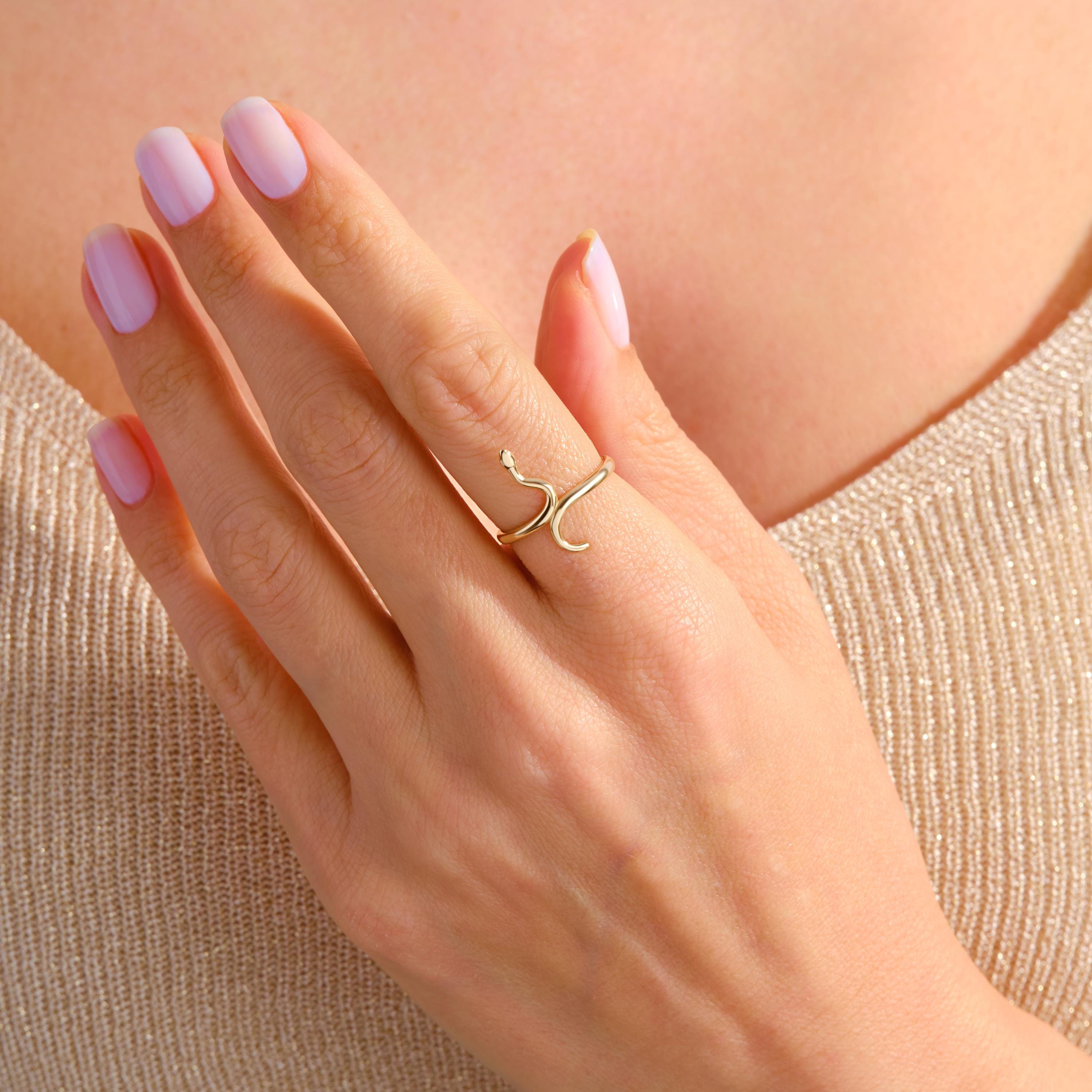 🐍 Snake Ring 14K Solid Gold – Minimalist Serpent Stackable Ring for Women

Add a touch of mystique and elegance to your jewelry collection with this stunning 14K solid gold snake ring. Designed for everyday wear, this minimalist serpent ring beautifully wraps around your finger with a delicate yet bold style. Perfect for stacking or wearing solo, it’s a unique piece that blends gothic charm with modern sophistication.