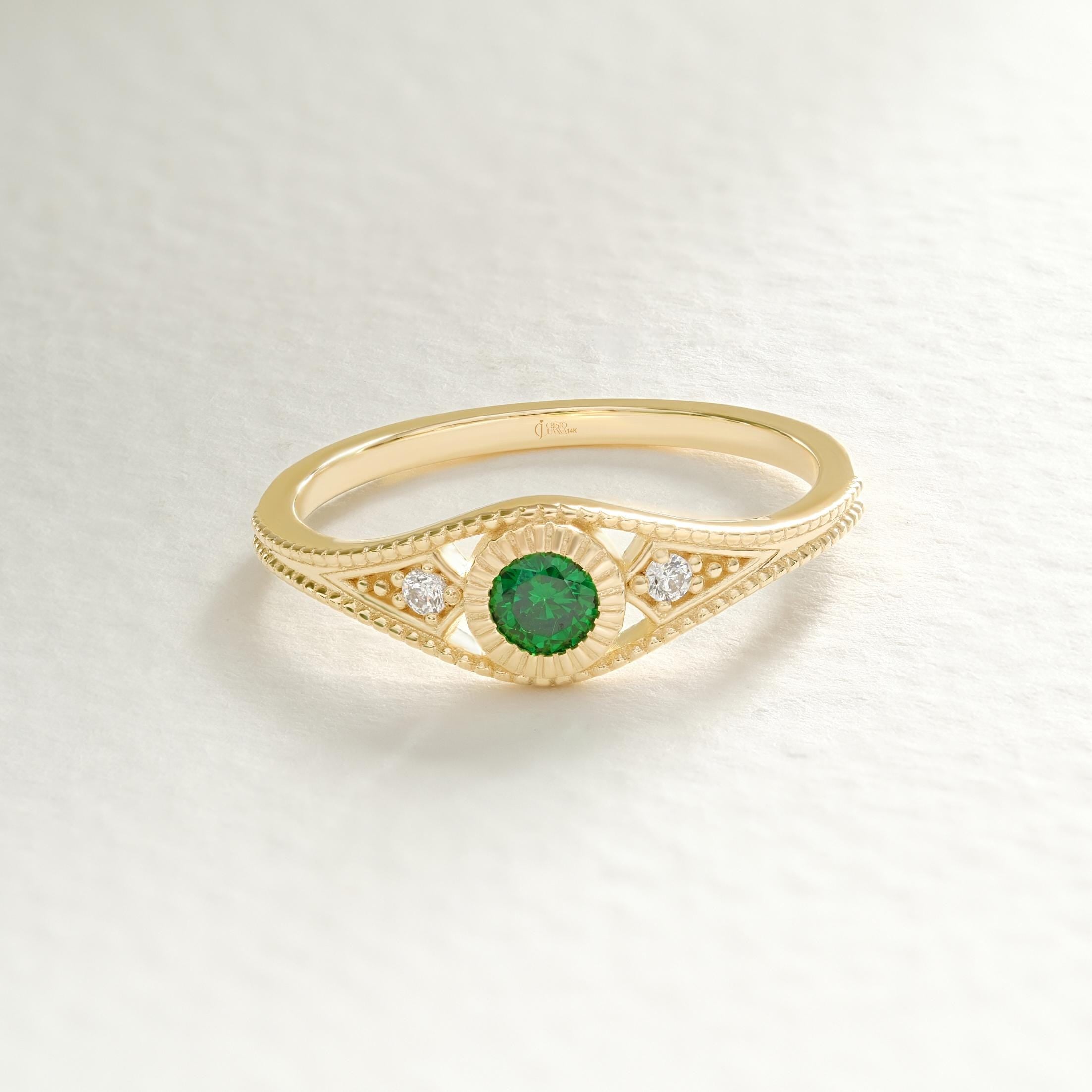Timeless in form and refined in detail, this emerald wedding ring is elevated by side diamond rings and a sculptural split shank ring 14k silhouette. Designed as a personalized present with birthstone artdeco inspiration, it bridges elegance and emotion. From emerald engagement to vintage braided band, every element speaks intention.