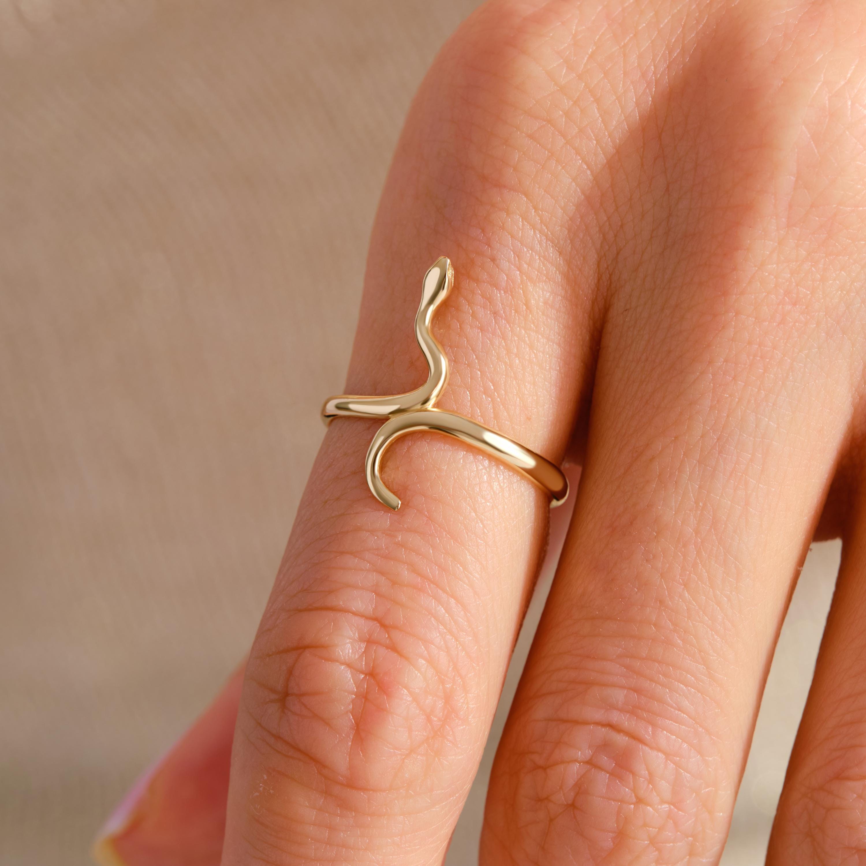 🐍 Snake Ring 14K Solid Gold – Minimalist Serpent Stackable Ring for Women

Add a touch of mystique and elegance to your jewelry collection with this stunning 14K solid gold snake ring. Designed for everyday wear, this minimalist serpent ring beautifully wraps around your finger with a delicate yet bold style. Perfect for stacking or wearing solo, it’s a unique piece that blends gothic charm with modern sophistication.