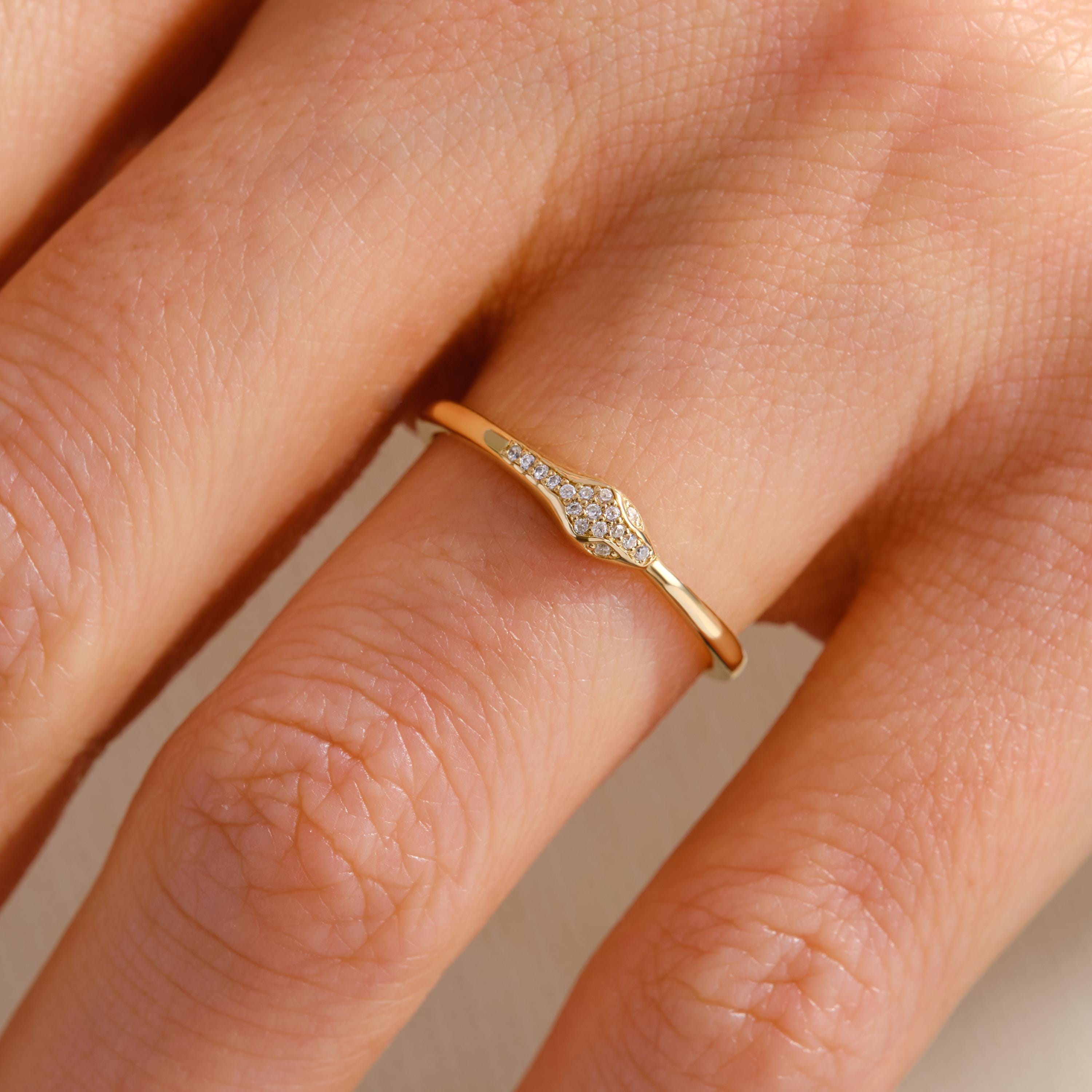 🐍 14K Gold Snake Ring with Diamond – Serpent Moissanite Gothic Band
Bold and symbolic, this dainty snake ring coils elegantly with shimmering stones across the head. A striking piece for lovers of gothic style, mythical symbolism, or unique minimalist jewelry.