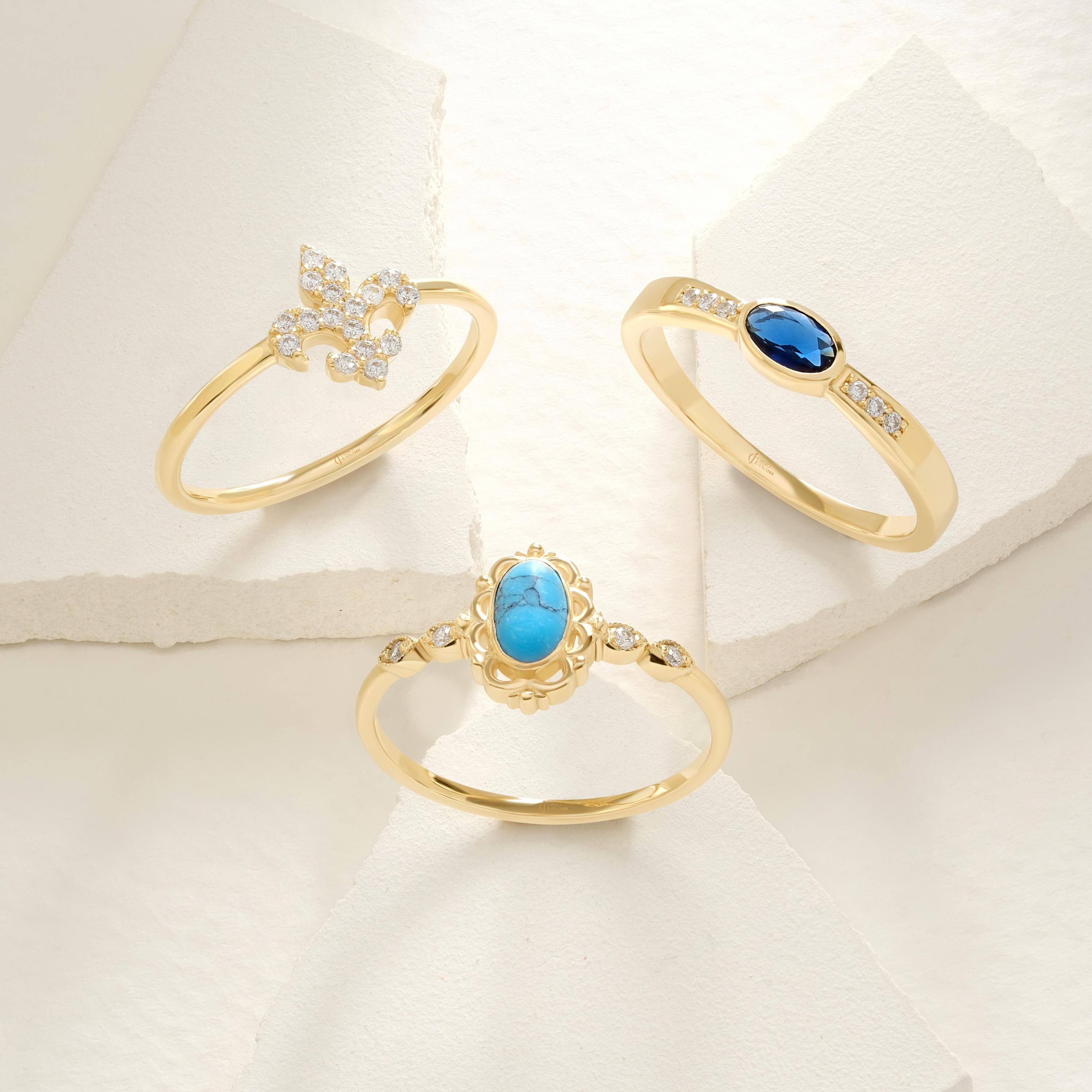 Fleur De Lis Diamond Ring – 14K Gold Stackable Lotus Symbol Ring for Women 💎🌸
A delicate blend of symbolism and sparkle, this Fleur De Lis ring features micro pave moissanite stones set in solid 14K gold. Representing purity, strength, and elegance, this lotus-inspired band is a meaningful and stylish choice for stacking or solo wear.