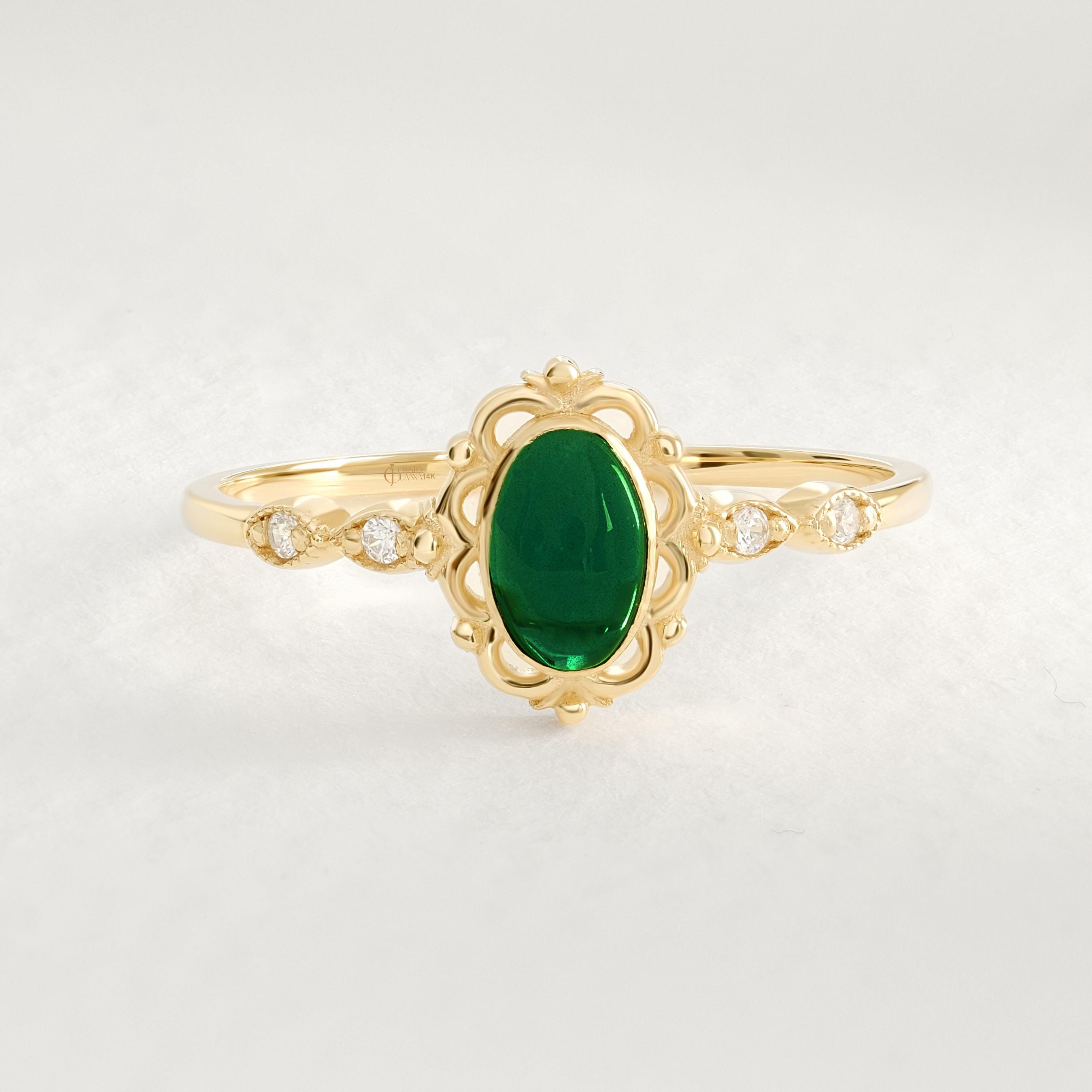 Art Deco Emerald Engagement Ring – 14K Solid Gold Filigree Wedding Band 💚✨
This stunning Art Deco Emerald Ring embodies timeless sophistication and handcrafted artistry. Featuring a vivid oval-cut emerald framed by sparkling side diamonds, the intricate filigree band showcases vintage charm with a modern twist. Perfect as a wedding, engagement, or anniversary gift, it’s a symbol of love, strength, and renewal.