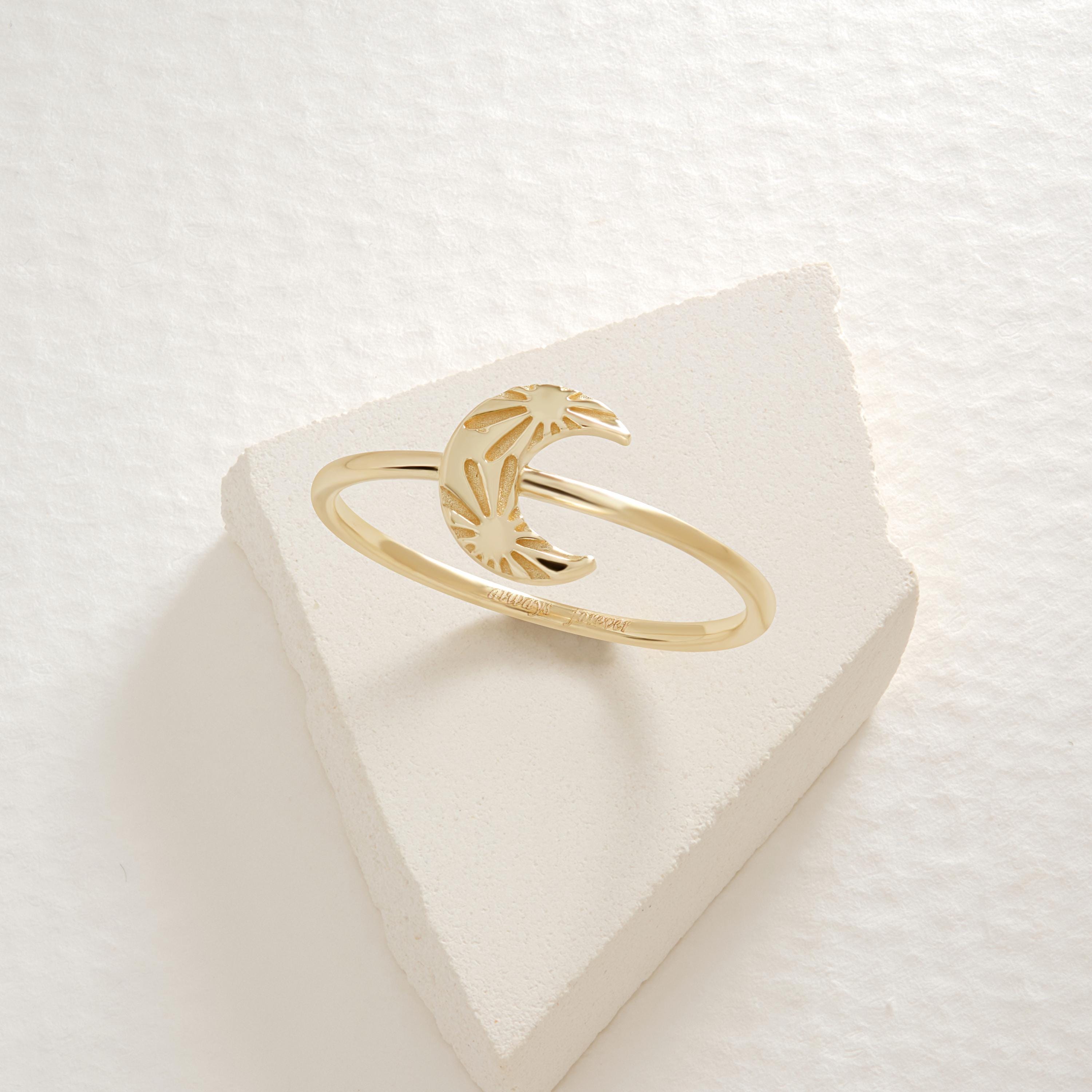 Crescent Moon Ring – 14K Solid Gold 🌙☀️
This delicate crescent moon ring features a moon and sun texture design, symbolizing balance, harmony, and the connection between day and night. Its minimalist style makes it perfect for everyday wear, stacking with other rings, or gifting to someone special who loves celestial jewelry.

The slim gold band is comfortable, timeless, and available in yellow, white, or rose gold — making it a versatile piece for any jewelry collection.