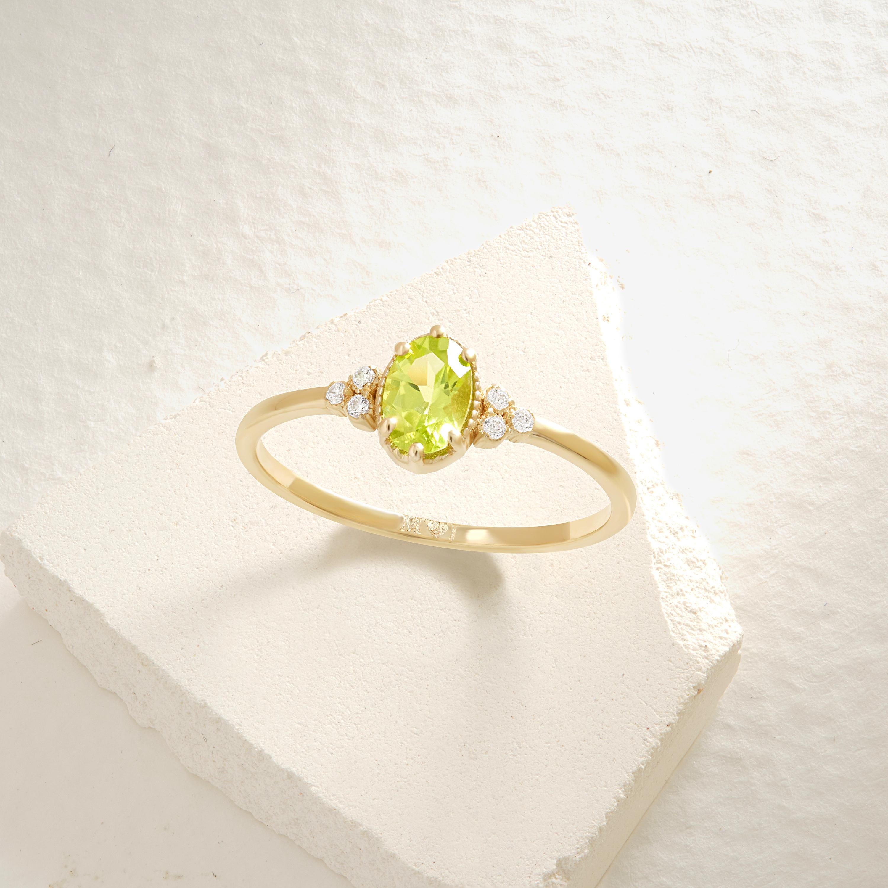 Natural Peridot Engagement Ring – 10K / 14K / 18K Solid Gold ✨💚
Celebrate love with this genuine oval-cut peridot ring, beautifully accented with sparkling side diamonds. Its fresh green glow makes it a unique engagement or wedding ring, perfect for women who adore natural beauty with a vintage touch.