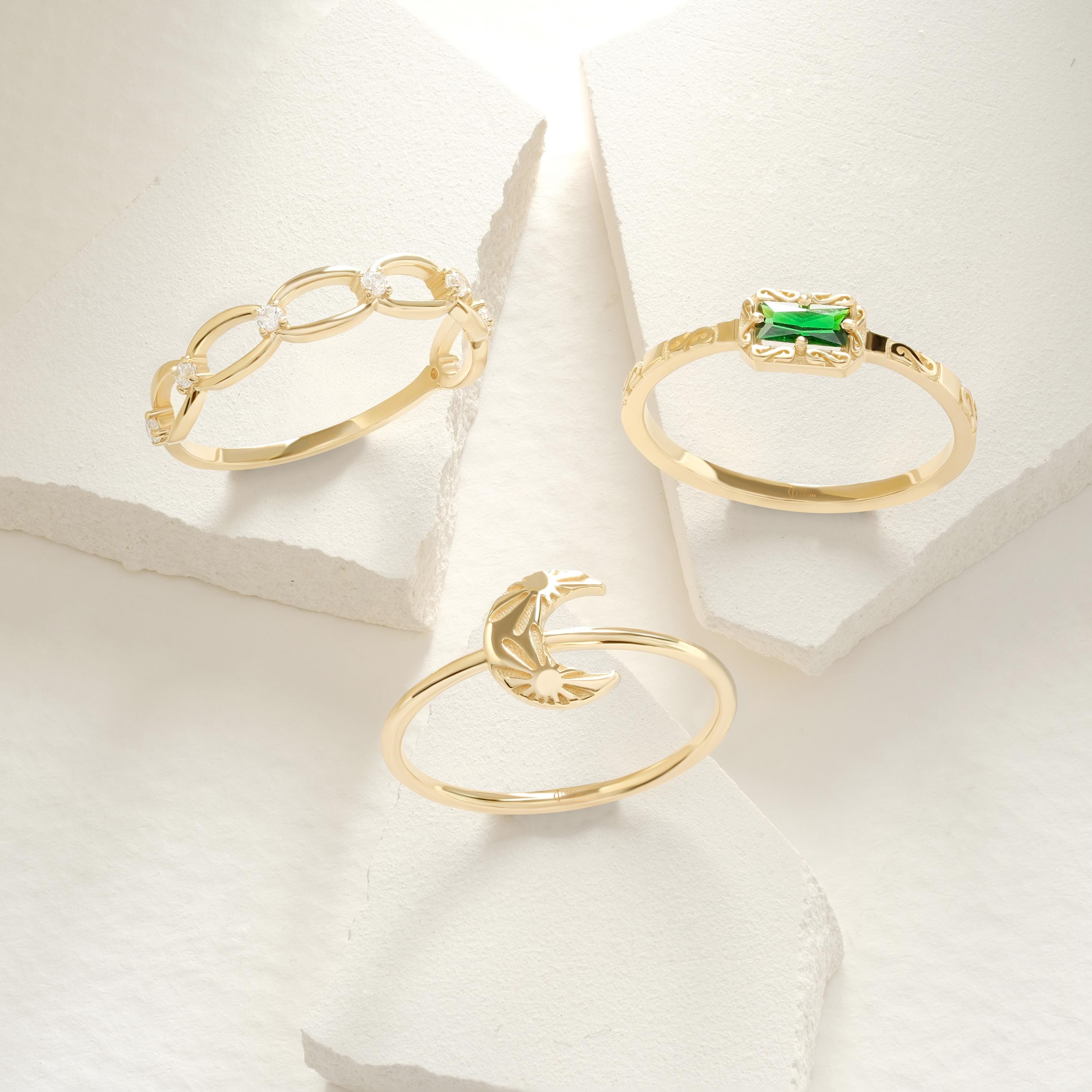 Crescent Moon Ring – 14K Solid Gold 🌙☀️
This delicate crescent moon ring features a moon and sun texture design, symbolizing balance, harmony, and the connection between day and night. Its minimalist style makes it perfect for everyday wear, stacking with other rings, or gifting to someone special who loves celestial jewelry.

The slim gold band is comfortable, timeless, and available in yellow, white, or rose gold — making it a versatile piece for any jewelry collection.