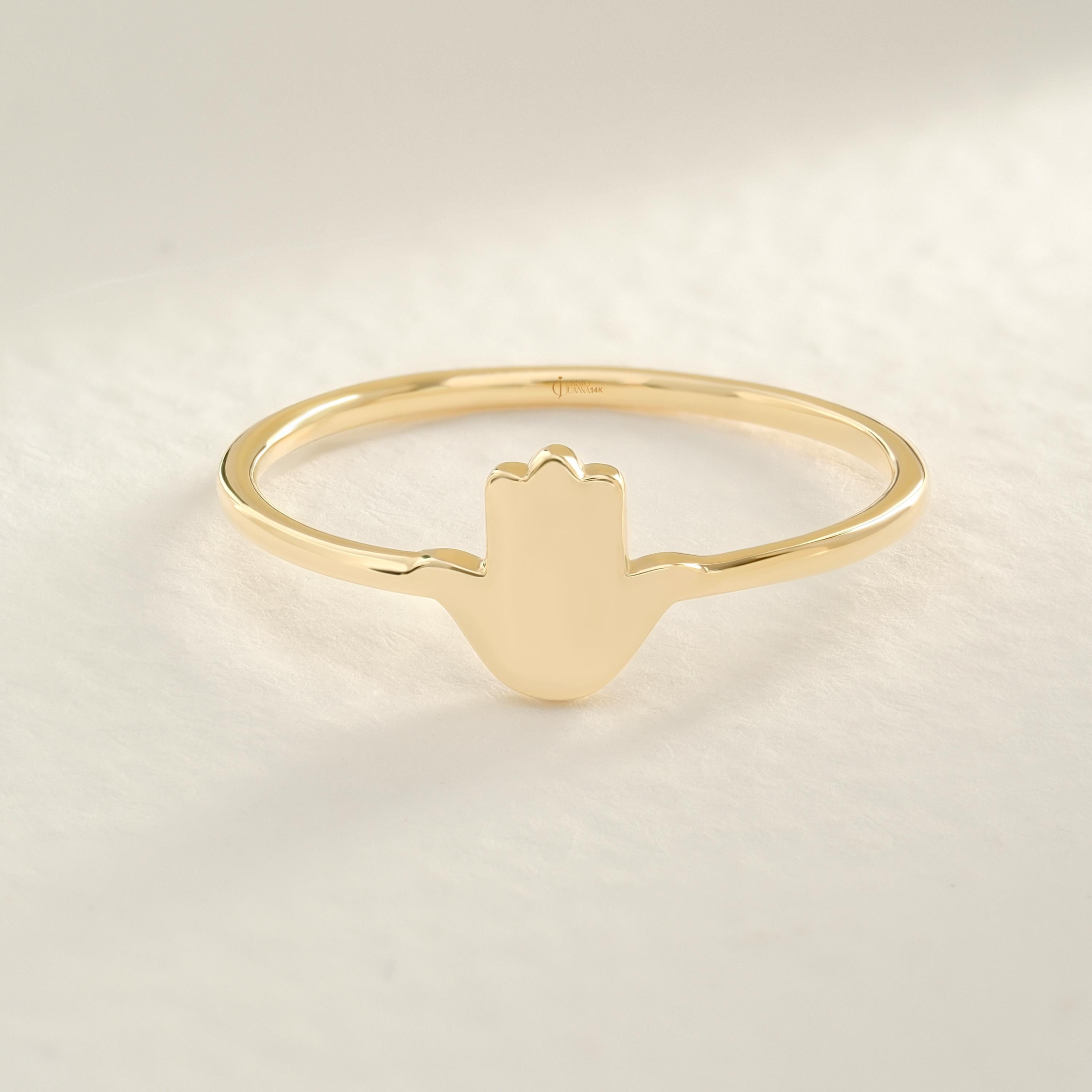Hamsa Hand Ring – 10K / 14K / 18K Solid Gold 🧿✨
A meaningful Hamsa Hand design symbolizing luck, protection, and positive energy. This dainty gold band can be worn alone or stacked with other rings, making it a perfect everyday piece and a thoughtful gift.
