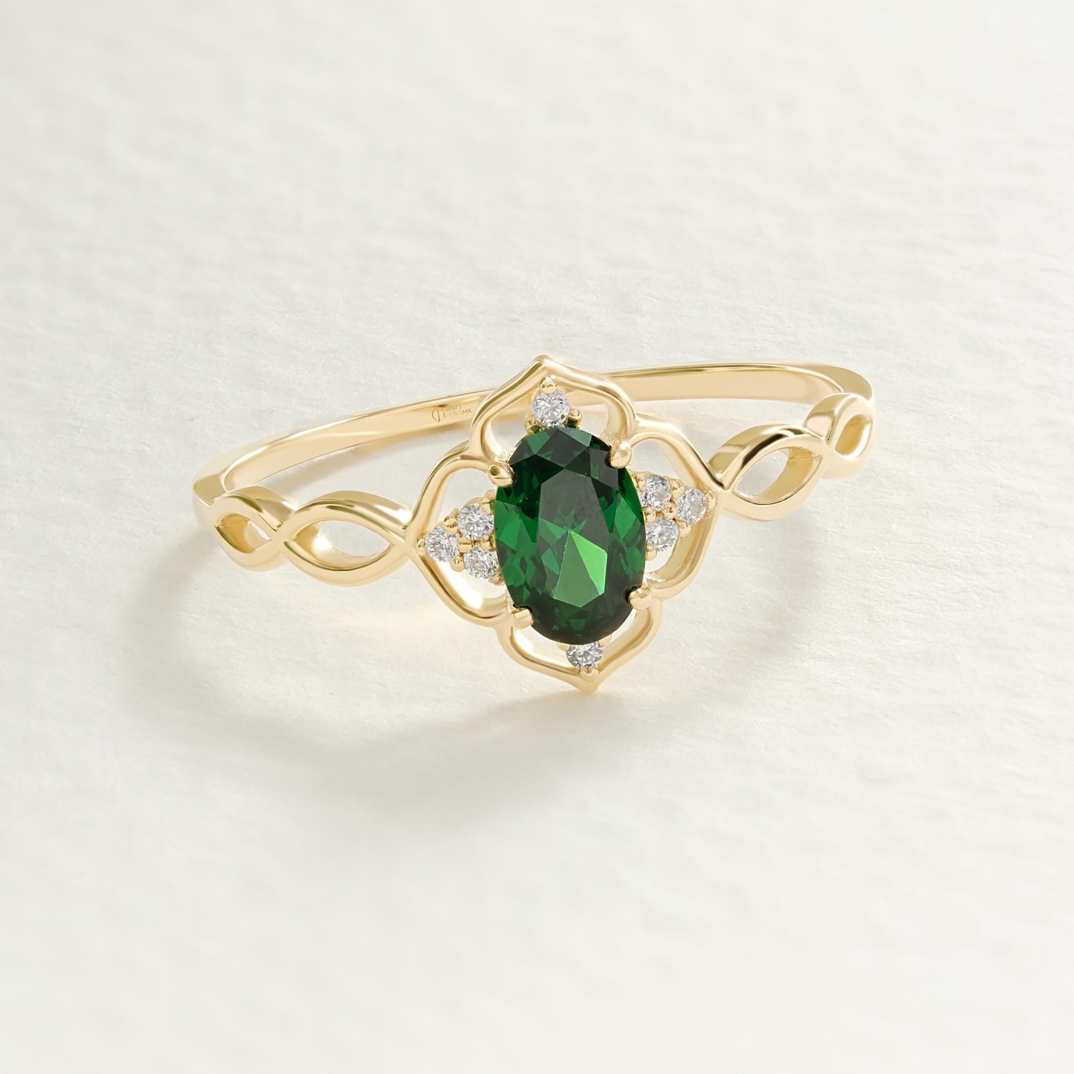 Oval Emerald Engagement Ring – 14K Solid Gold Lace Infinity Band 💚✨
A romantic fusion of elegance and vintage artistry — this oval emerald engagement ring features a vivid green center stone embraced by sparkling side diamonds along a lace-inspired infinity band. Handcrafted in solid 14K gold, its split-shank design symbolizes eternal love, balance, and connection, making it the perfect birthstone or anniversary ring.
