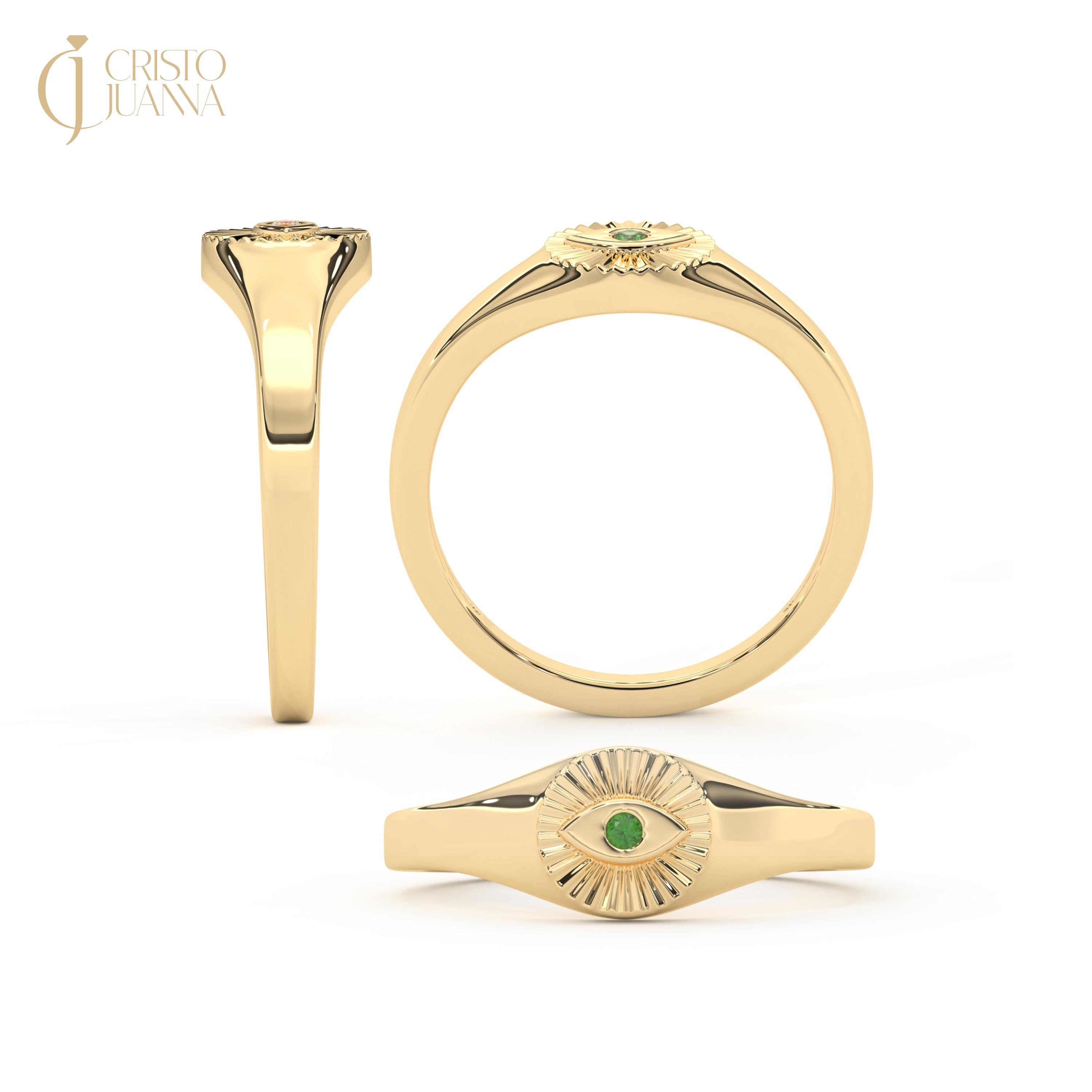 ChatGPT:

💚 Emerald Eye Signet Ring – 14K Solid Gold Bezel Set Evil Eye Dome Band 💍

Protective, elegant, and full of symbolism — this Emerald Eye Signet Ring brings a modern twist to the ancient evil eye design. Crafted from solid gold and featuring a brilliant green cubic zirconia stone, this dainty yet bold piece radiates both style and meaning. Perfect as a pinky ring, everyday statement, or symbolic gift of protection.