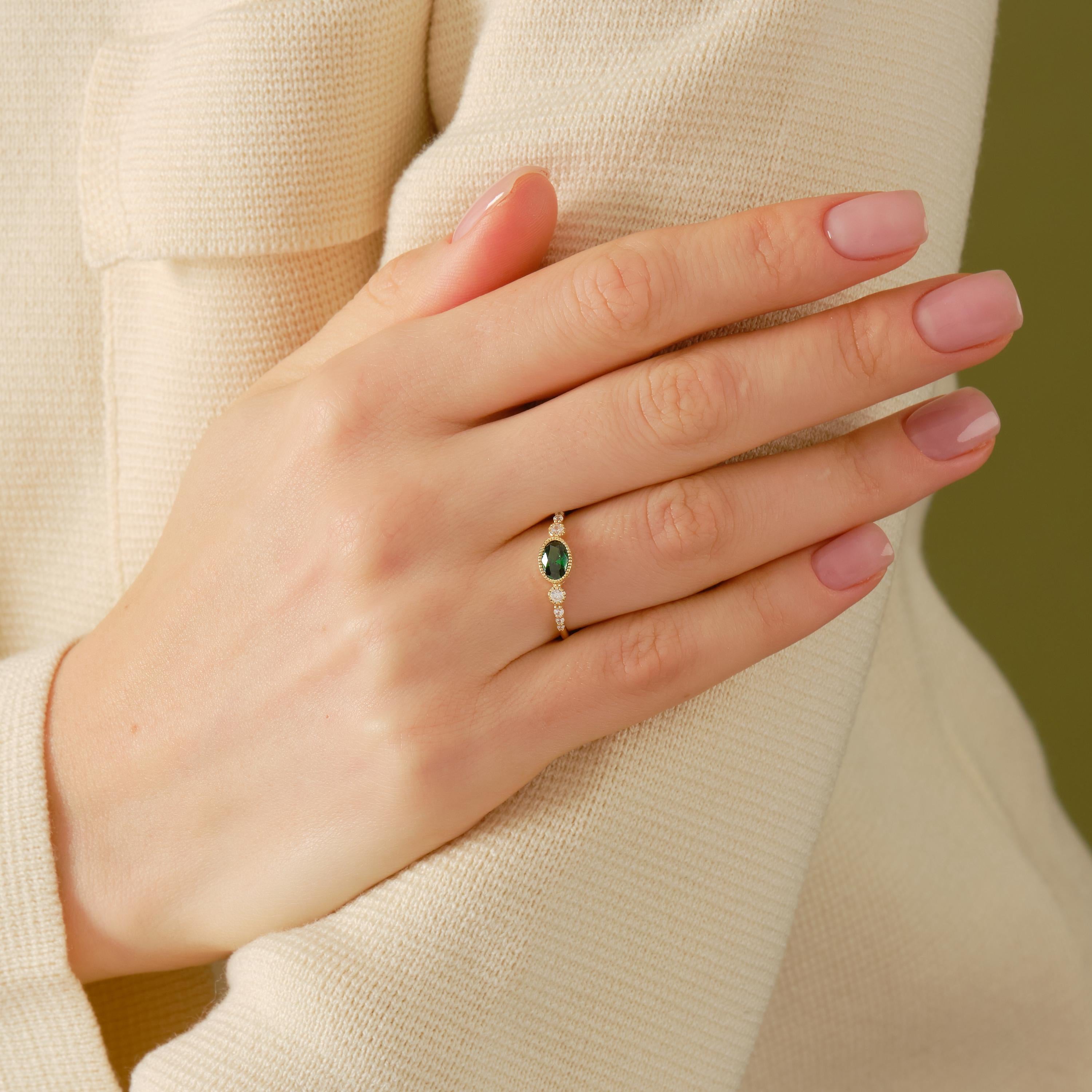 💚 Vintage Inspired Emerald Ring | Oval Birthstone Ring with Side Diamonds – 14K Solid Gold

This vintage inspired emerald ring showcases a timeless Art Deco elegance, featuring a glowing oval-cut green gemstone framed in a sleek bezel setting and accented with sparkling side stones. Handcrafted in solid gold, this ring blends classic charm with modern craftsmanship—perfect for meaningful moments and everyday luxury.