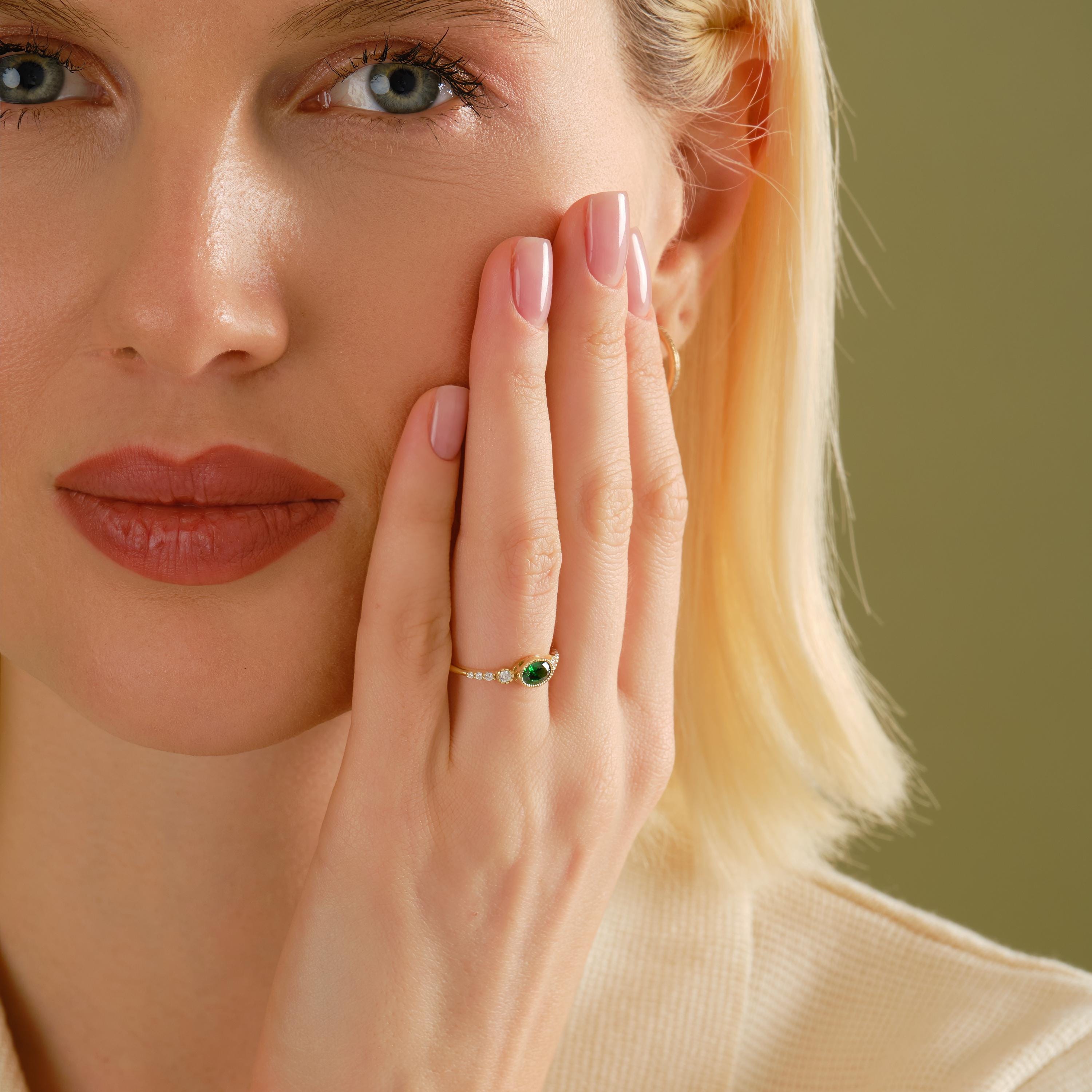 💚 Vintage Inspired Emerald Ring | Oval Birthstone Ring with Side Diamonds – 14K Solid Gold

This vintage inspired emerald ring showcases a timeless Art Deco elegance, featuring a glowing oval-cut green gemstone framed in a sleek bezel setting and accented with sparkling side stones. Handcrafted in solid gold, this ring blends classic charm with modern craftsmanship—perfect for meaningful moments and everyday luxury.