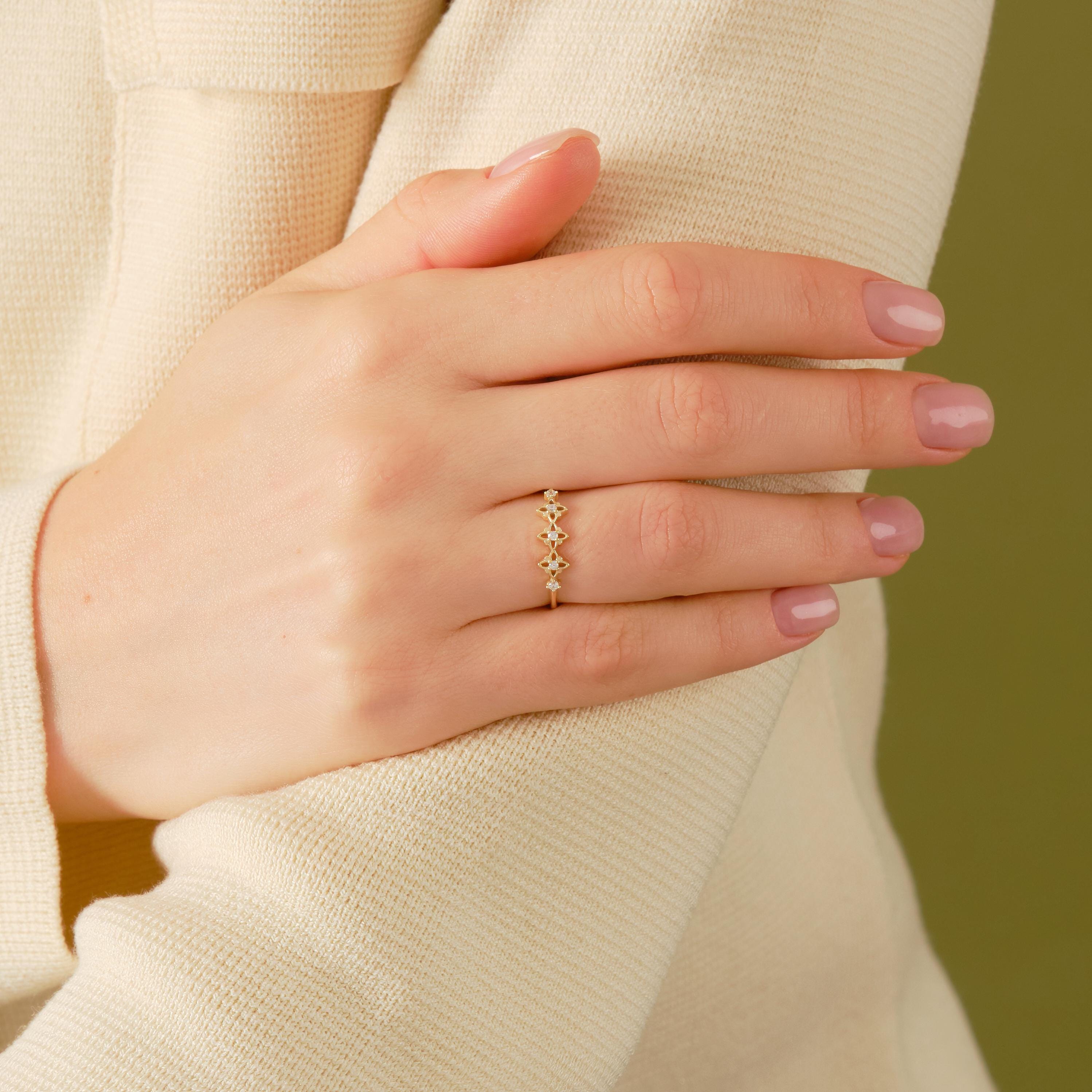 ✝️ Rosary Cross Diamond Ring | 14K Solid Gold Tiny Moissanite Band

Minimal yet deeply meaningful, this Rosary Cross Diamond Ring blends spiritual symbolism with modern elegance. Featuring scattered tiny stones arranged in a delicate cross motif and subtle clover-inspired details, this handcrafted ring is designed for everyday wear and timeless devotion.