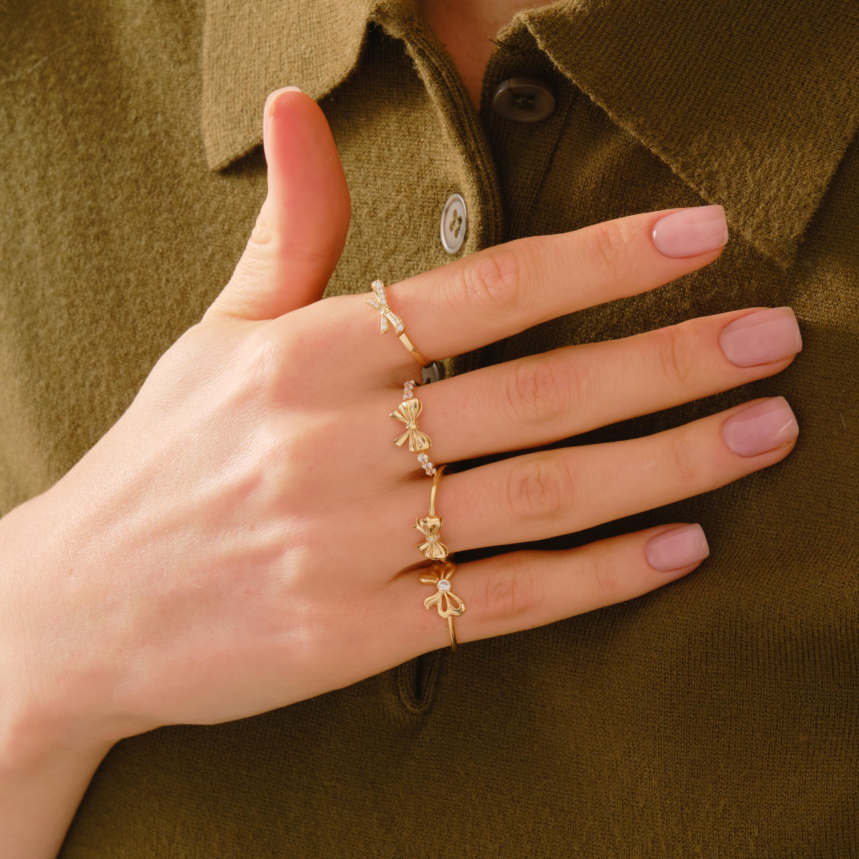 ✨ 14K Solid Gold Ribbon Ring – Dainty Diamond Bowtie Ring for Women
Little Bowknot Ring • Symbol of Love, Friendship & Soulmates

Graceful, feminine, and full of meaning 🤍 This dainty ribbon bowtie ring is designed to symbolize unbreakable bonds—perfect for soulmates, best friends, or a heartfelt gift for someone special. Its elegant bow shape and delicate sparkle make it ideal for everyday wear.