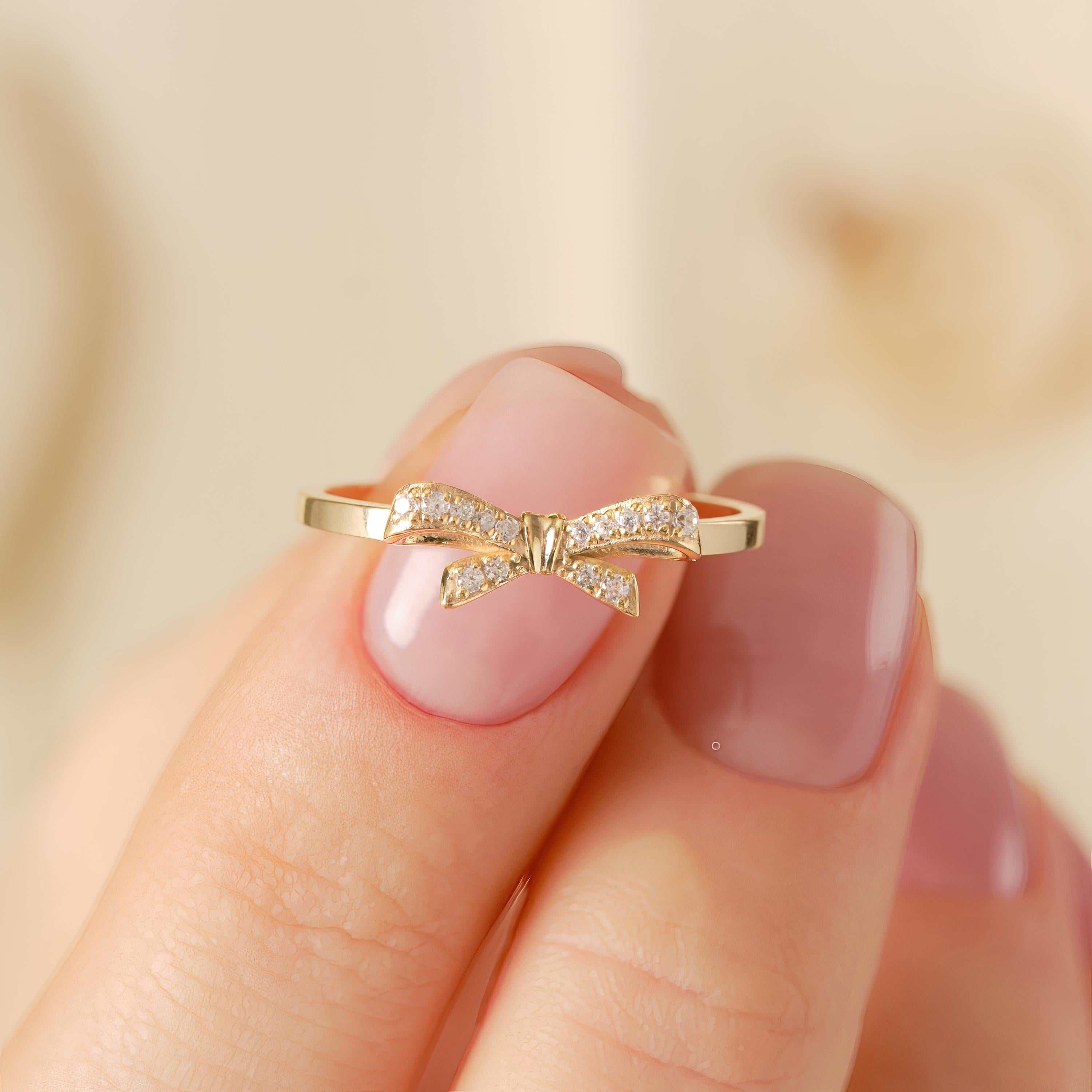 ✨ 14K Solid Gold Ribbon Ring – Dainty Diamond Bowtie Ring for Women
Little Bowknot Ring • Symbol of Love, Friendship & Soulmates

Graceful, feminine, and full of meaning 🤍 This dainty ribbon bowtie ring is designed to symbolize unbreakable bonds—perfect for soulmates, best friends, or a heartfelt gift for someone special. Its elegant bow shape and delicate sparkle make it ideal for everyday wear.